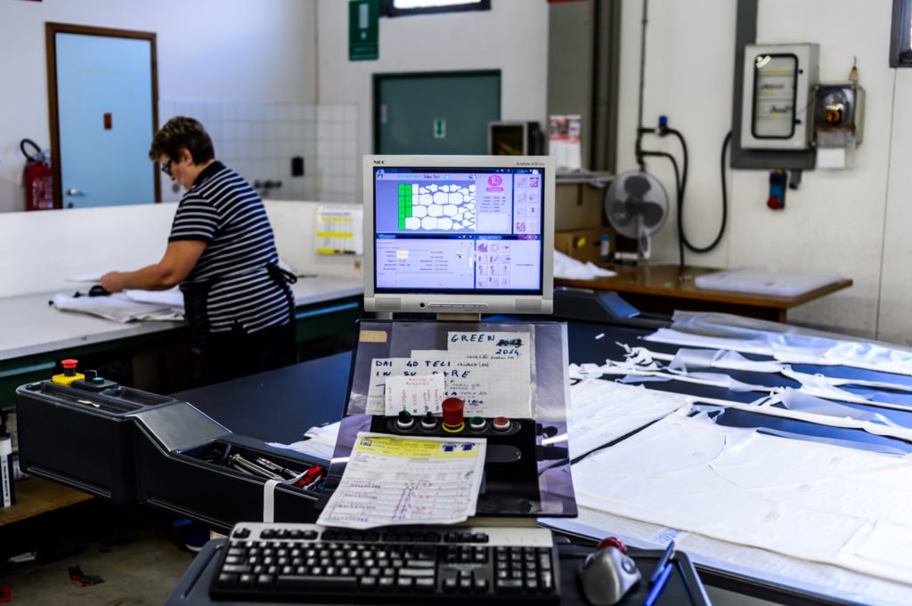 Cutting room pattern layout and CAD marker review for OEM outerwear production