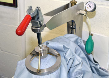 Fabric pressure testing equipment for waterproof outerwear quality review