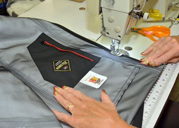 Jacket sewing and label detail for OEM waterproof outerwear production